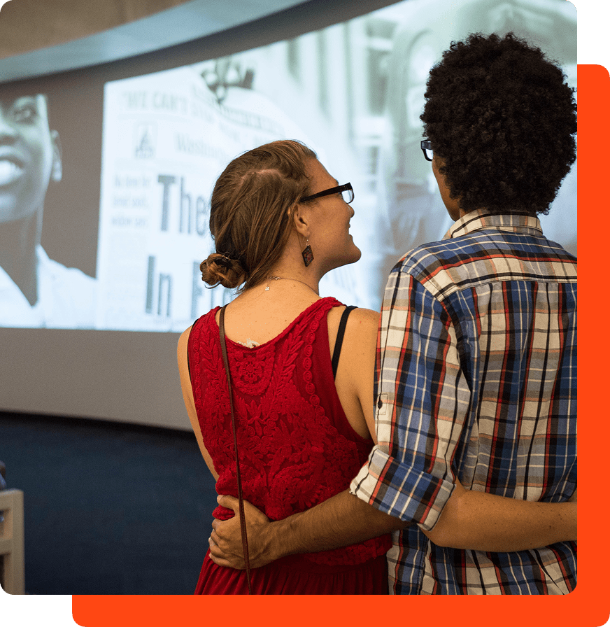 A couple watching an educational film at The National Center for Civil and Human Rights