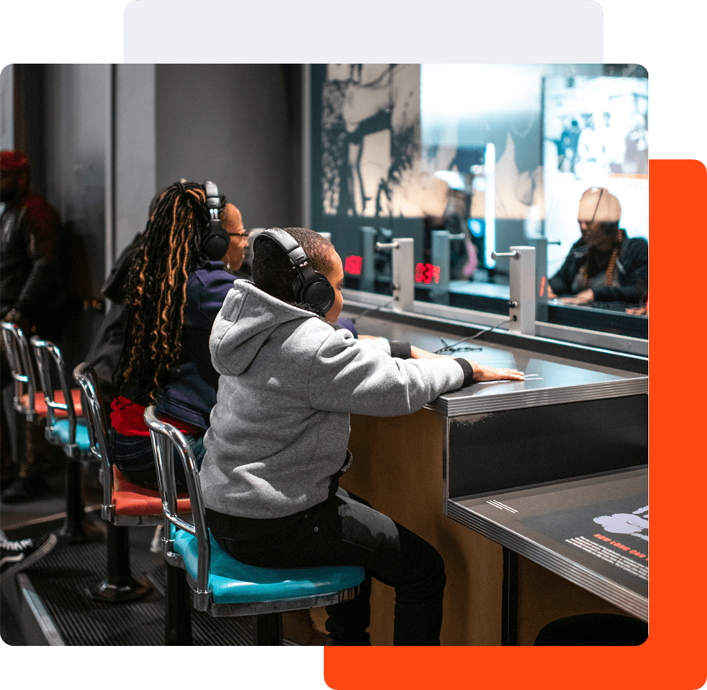 Visitors experiencing the Rolls Down Like Water exhibit