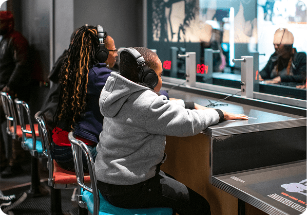 Visitors experiencing the Rolls Down Like Water exhibit at the NCCHR