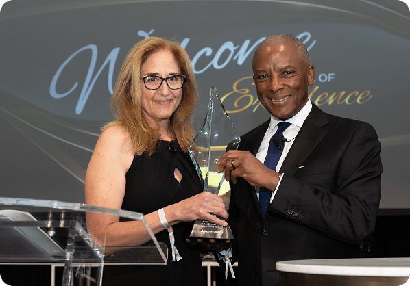 Attendees receiving an award at an event hosted at the NCCHR