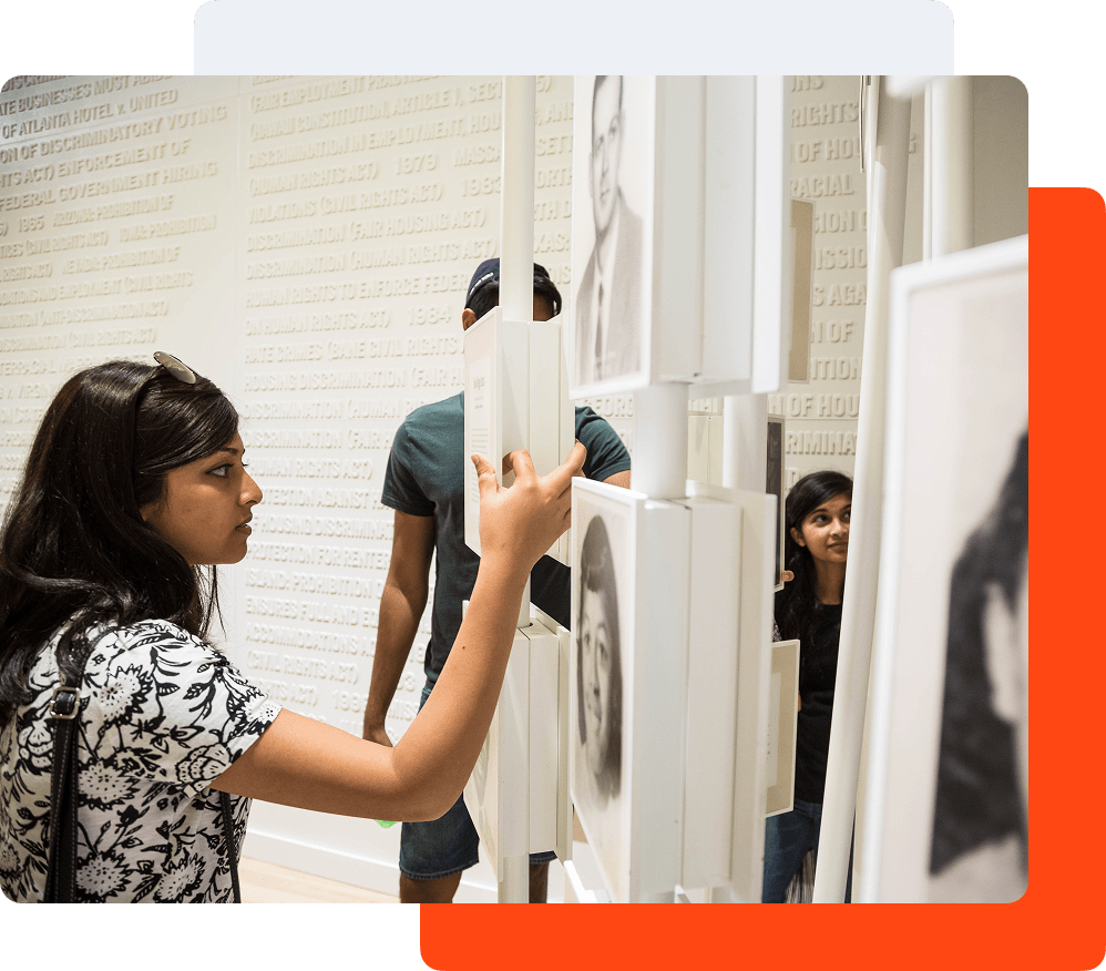 Visitor viewing an image that's a part of an exhibition at The National Center for Civil and Human Rights