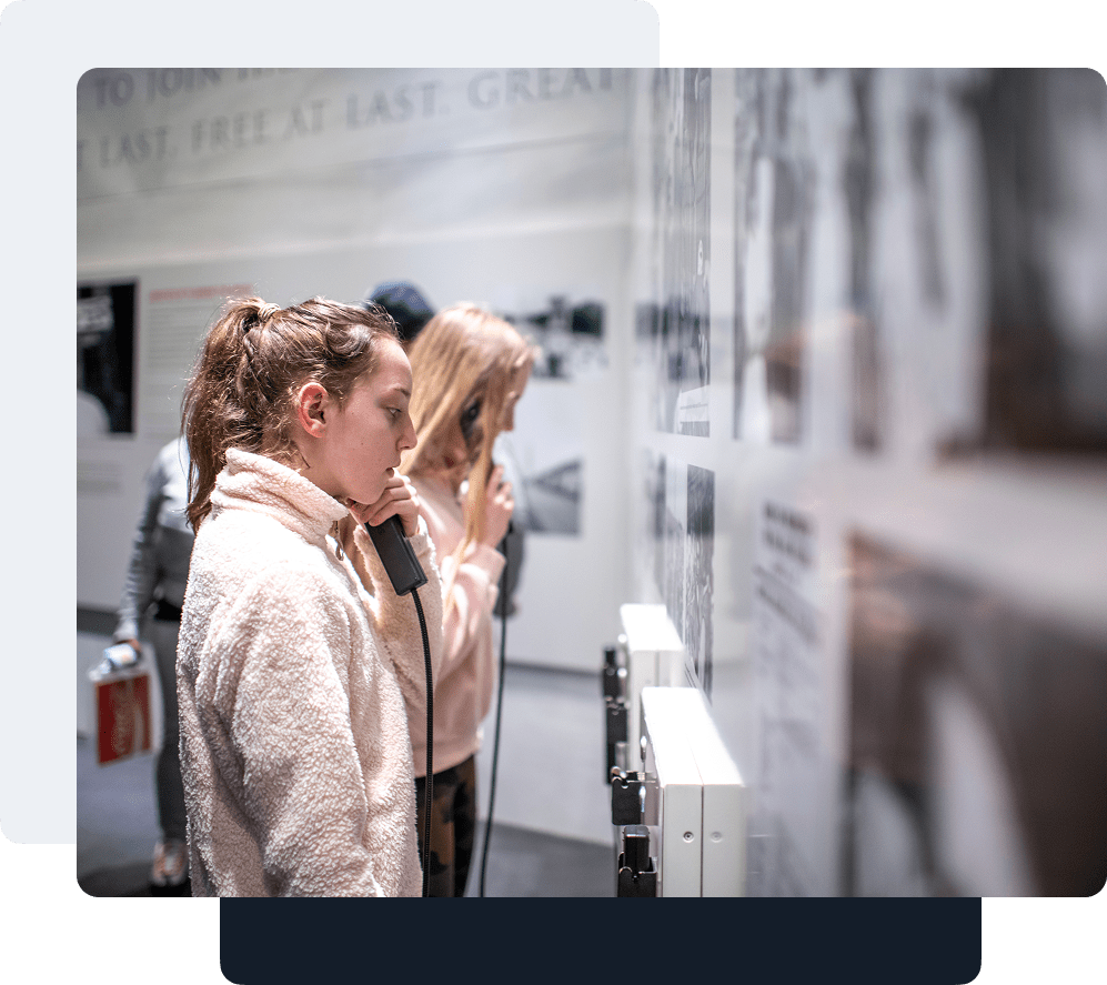 Visitor interacting with an exhibit at The National Center for Civil and Human Rights