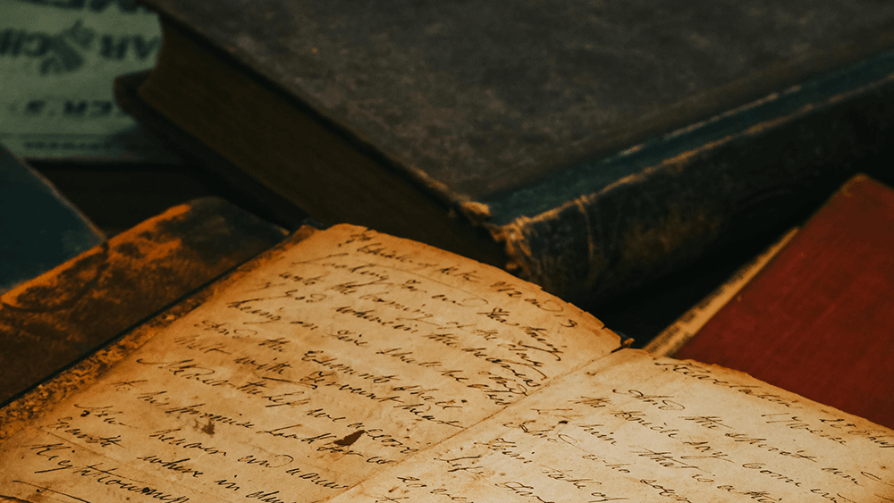 Books and pages with handwritten text