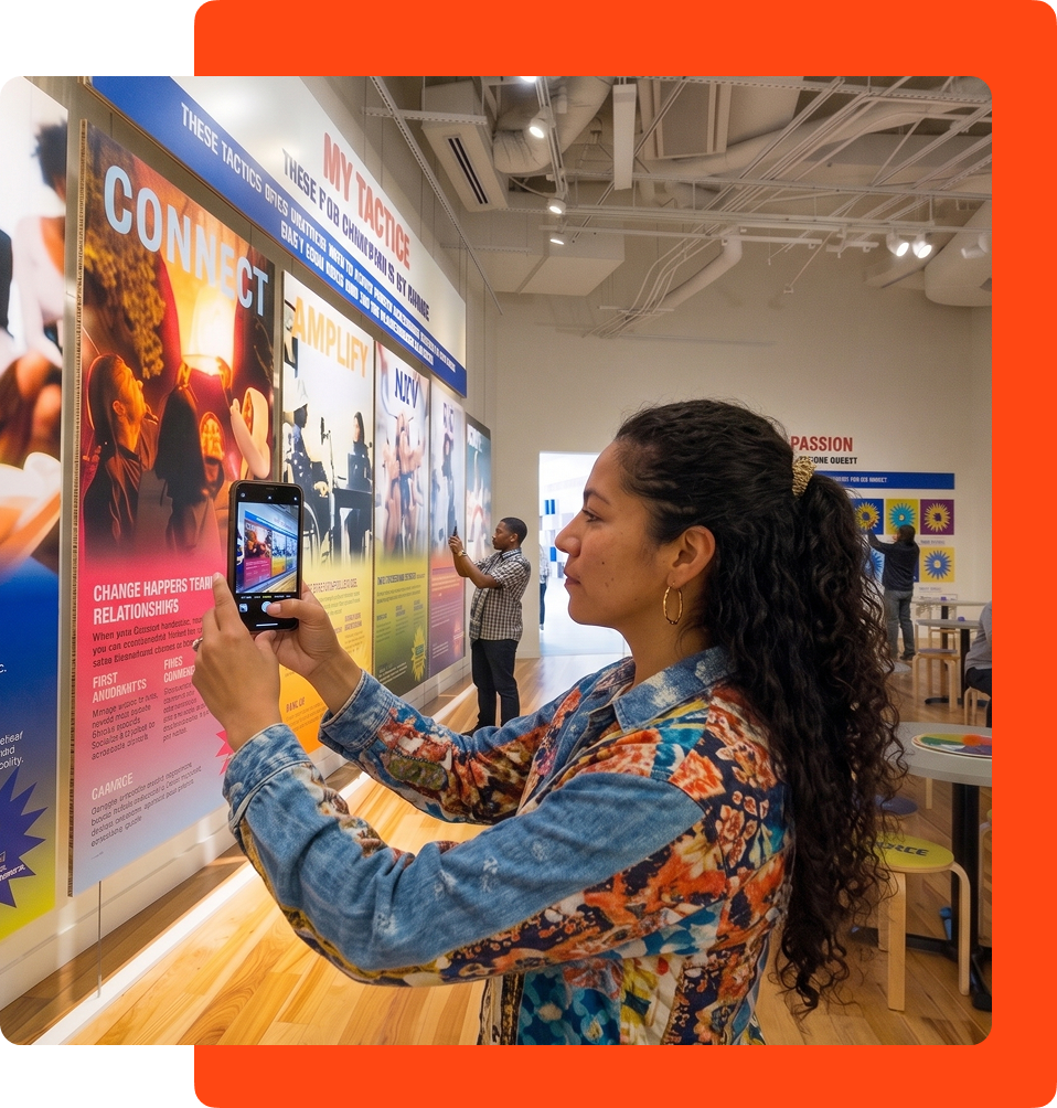 Woman taking a photo of an exhibit at NCCHR