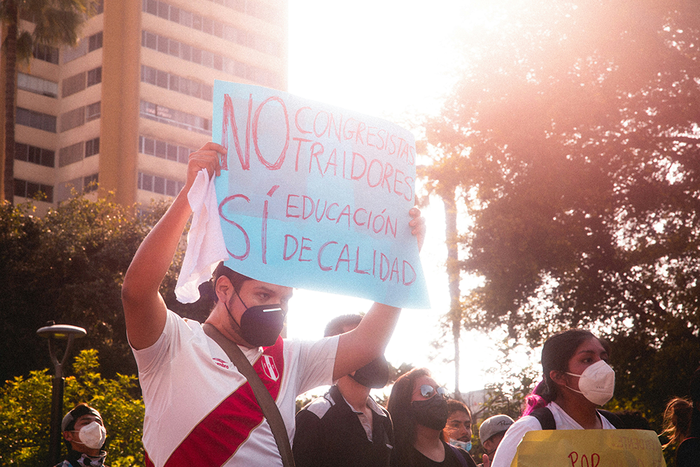 Latino protestors holding signs